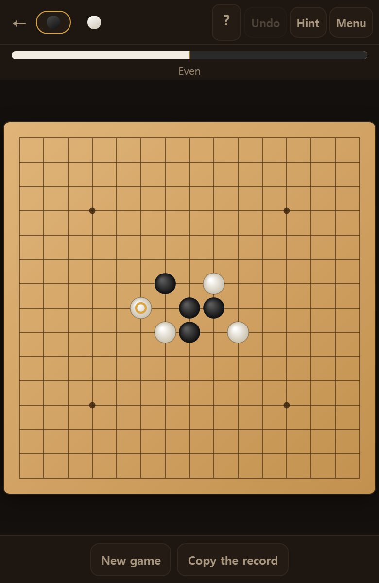 A few moves in. Stones sit on the points where the lines cross, not inside the squares.
