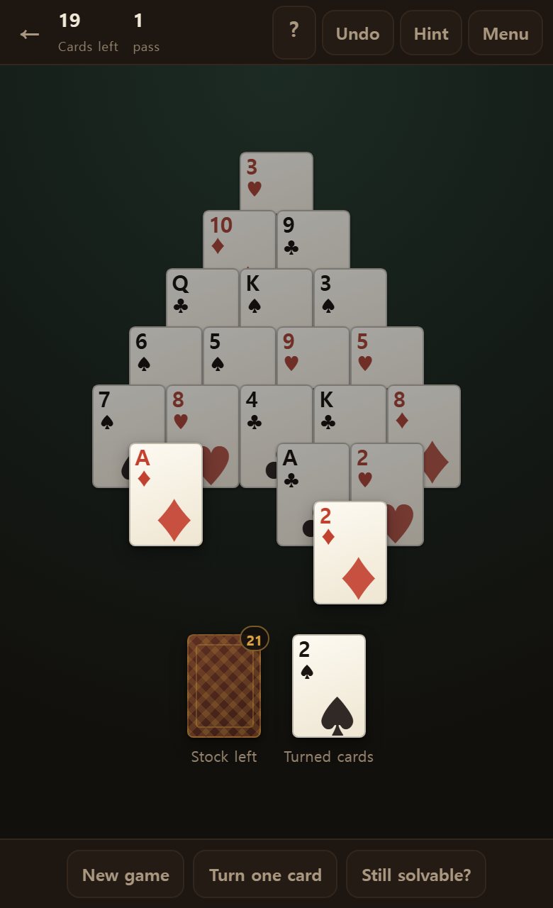 Twenty-eight cards stacked in a triangle. The two places below are the stock and the turned card.