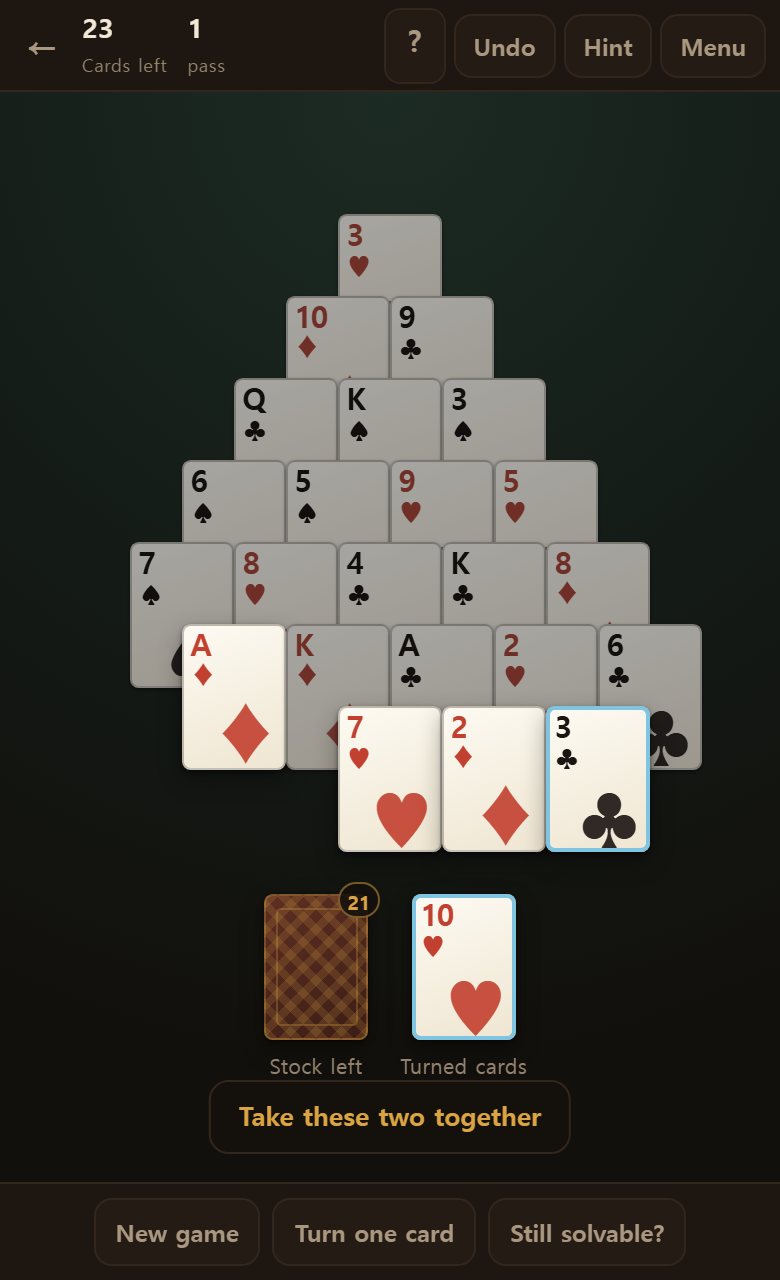 Hint marks the two cards to take in blue. Tap them in turn and they come off.